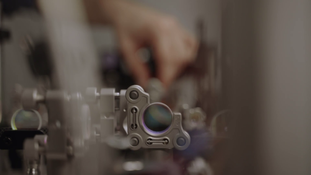 Precision optical lenses used in photonic quantum computing experiments zoom
